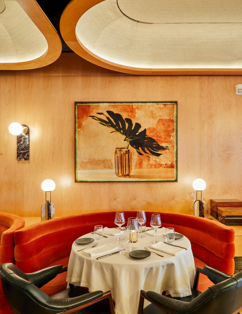 The interior, designed by a Brooklyn-based firm, is reminiscent of a 1970s Riva yacht.