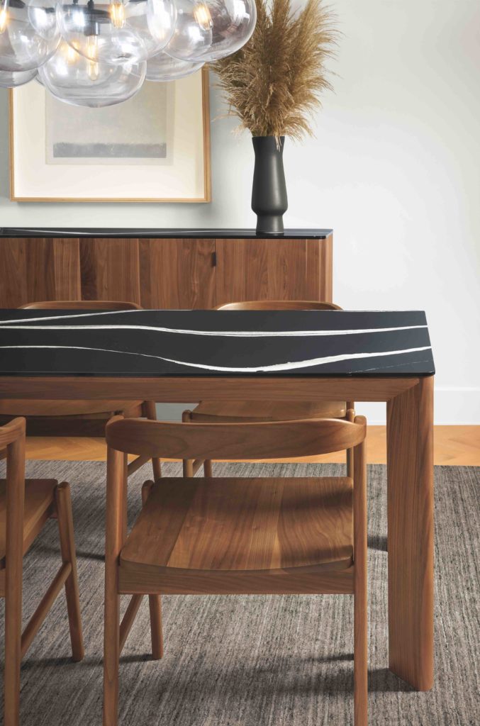 Room & Board's new Pren collection with Cambria includes tables with natural quartz tops. Pictured in Mersey dark quartz.