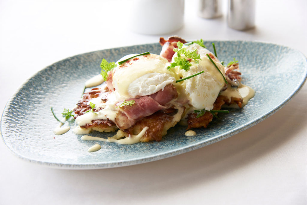 Bubbie's Benedict: poached eggs with shaved corned beef and crème fraîche, served atop a potato latke.
