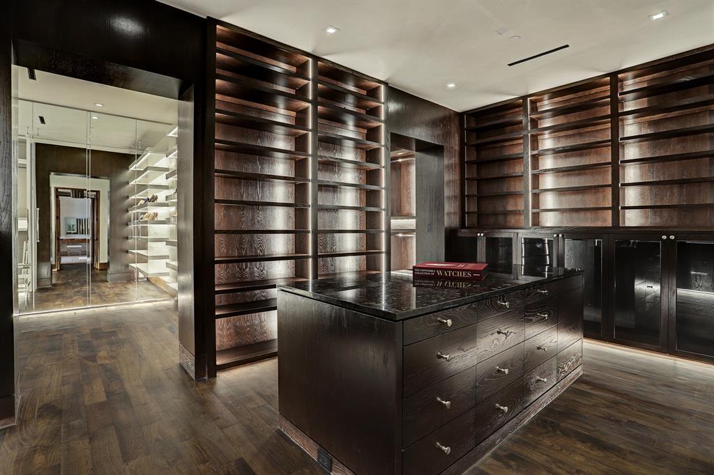 Note the adjoining lady's closet where her shoes get the special treatment as well in the home at 9111 Memorial Drive.