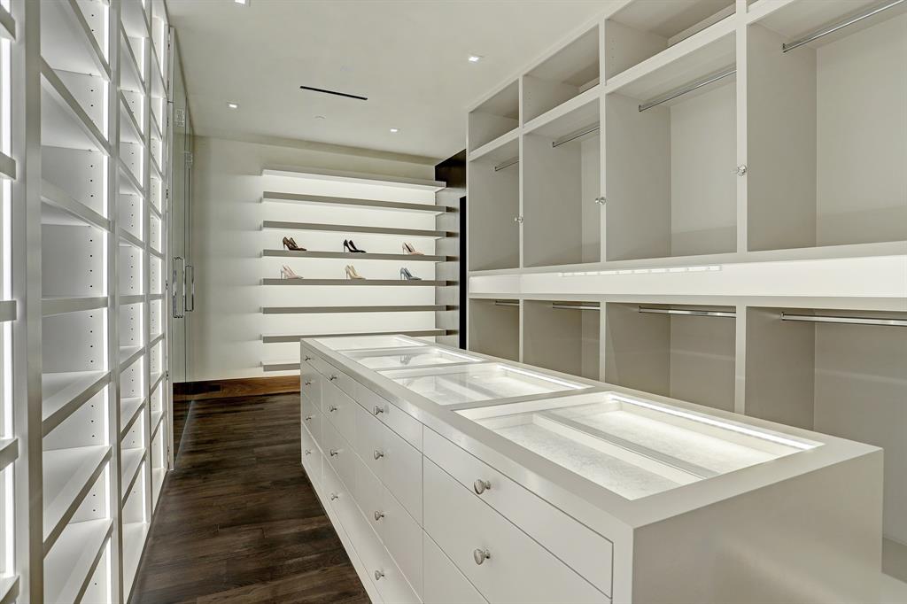 The feminine side of the master closet at 9111 Memorial is spacious and light-filled.
