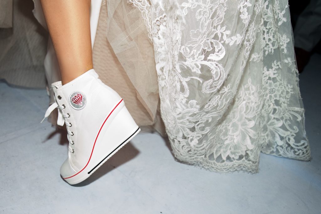 The bride wore athletic booties for dancing at the Pruner-Gómez del Campo Neme wedding. (Photo by Graciela Ubando)