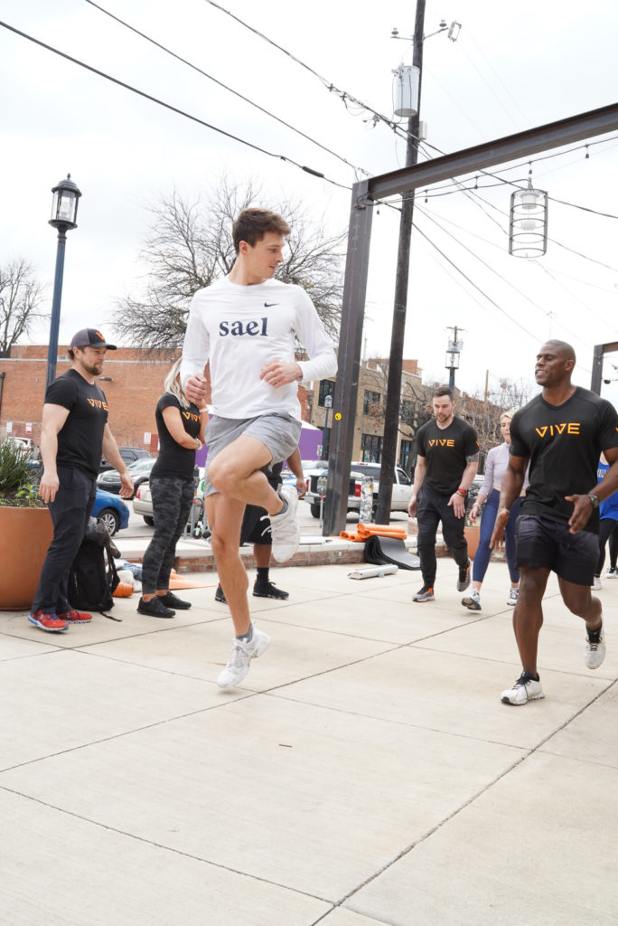 Vive Training led a vigorous workout outside of Jade + Clover on Deep Ellum's Main Street.  (Photo by Hannah Gibson)