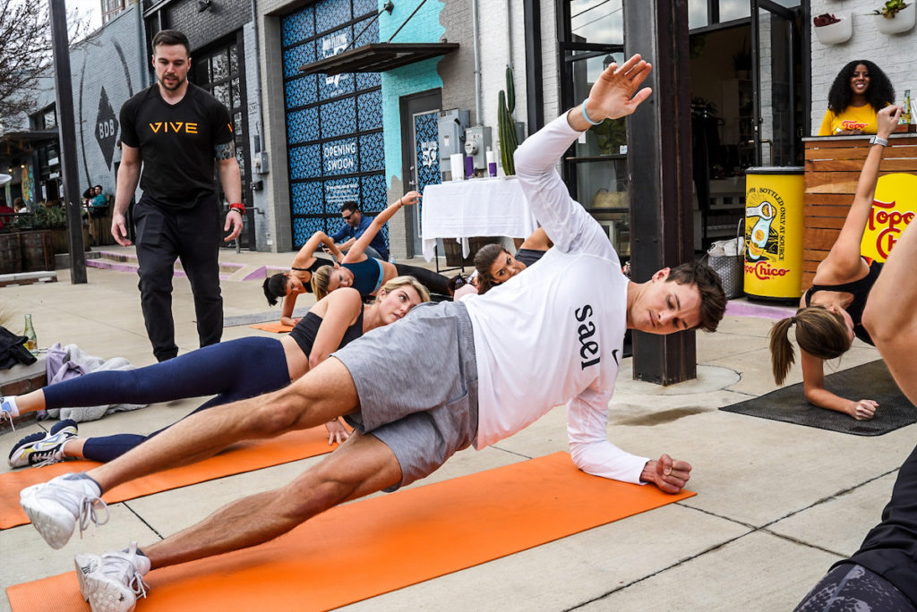 Vive Training led a vigorous workout outside of Jade + Clover on Deep Ellum's Main Street.  (Photo by Hannah Gibson)