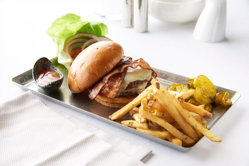 Ellie's Burger is made with Texas CBS Blend and smoked thick cut bacon, all served on brioche bun. 