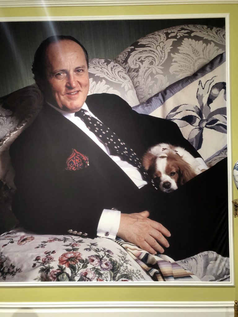 A portrait of Buatta and one of his beloved Cavalier King Charles Spaniels beamed down over the exhibition.  (Photo by Lacelliese King)