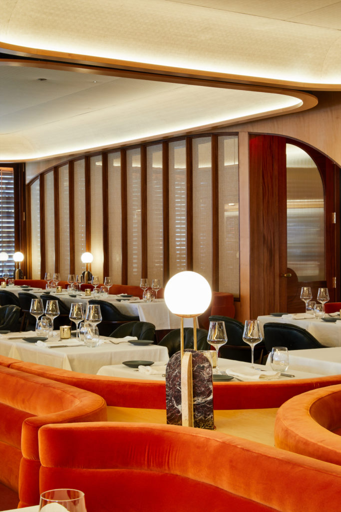 Plush orange seating and wooden accents make Georgie one of the prettiest new restaurants in Dallas.