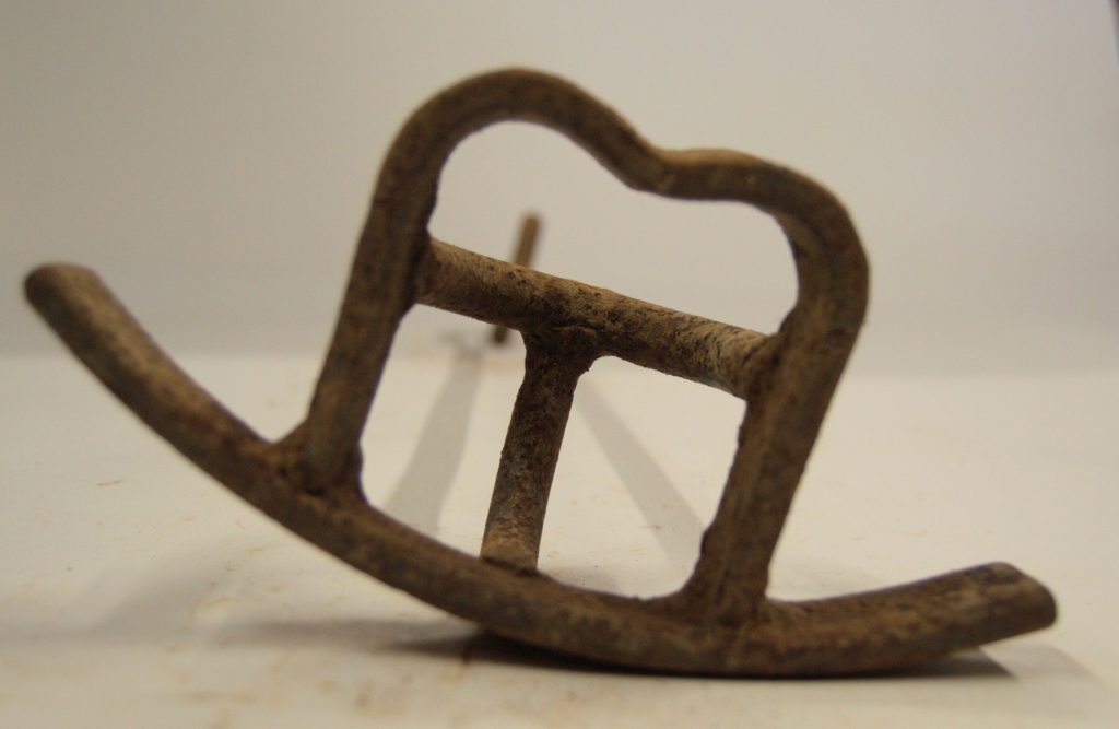 Rusty pieces of art and history dangle overhead at The Brand Room.