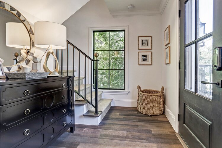 The entry hall with adjacent staircase. (Photo by TK Images)