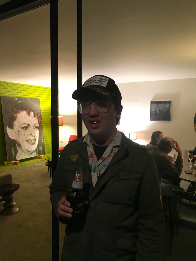 Artist/designer/friend/collector Peter Lee with Michael Bevilacqua's "Judy, Judy, Judy," 2018, on opening night.