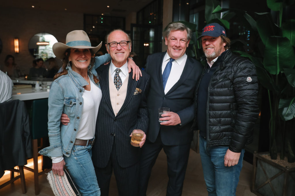 Party crashers Annie Amante and Adam Kliebert with party guests in center Robert Sakowitz and Neal Hamil. (Photo by Johnny Than)