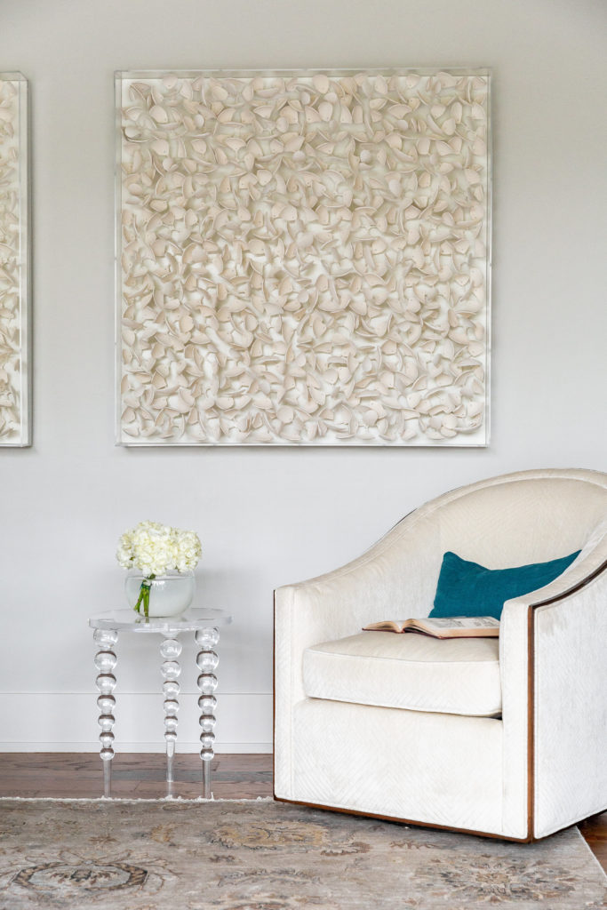The sitting area in the master bedroom features artworks from Palecek. They are handcut coco wood in petal shapes, cased in a plexi shadowbox. (Photo by Jen Burner)