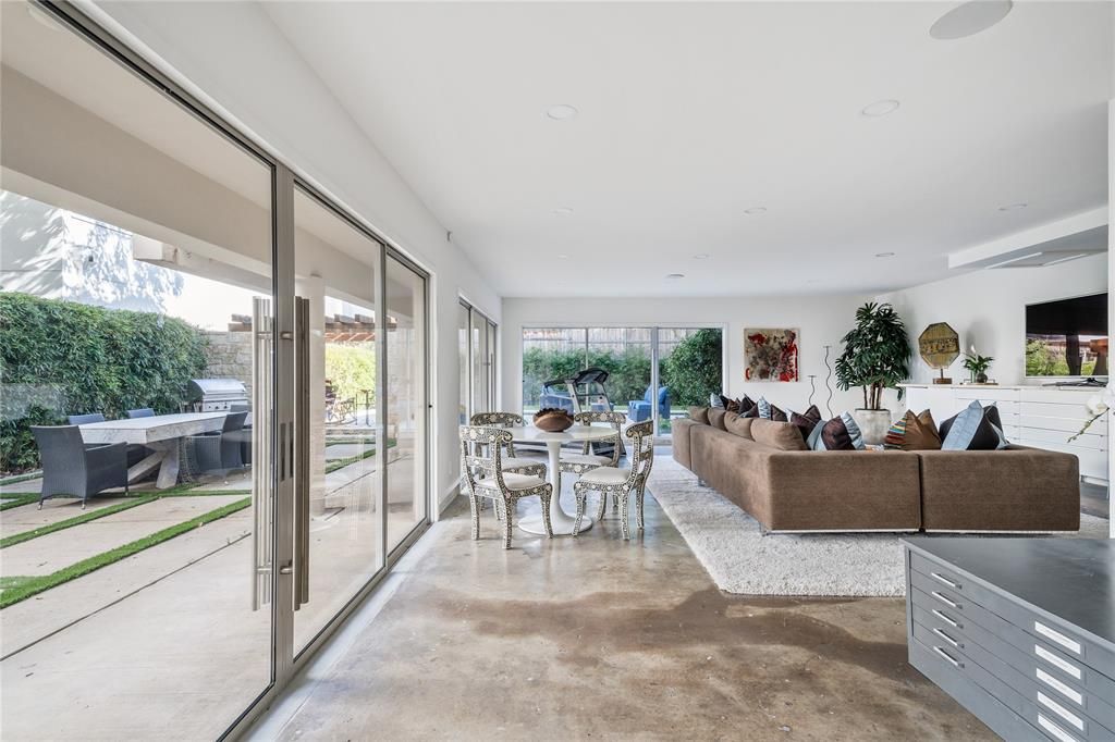 The bottom floor offers views of the clean-lined lap pool. (Photo by Briggs Freeman Sotheby's)