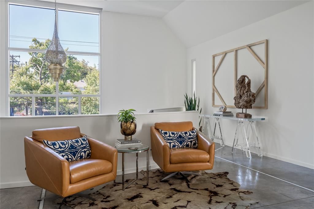 A cozy seating area marks the entrance to an upper level. (Photo by Briggs Freeman Sotheby's)