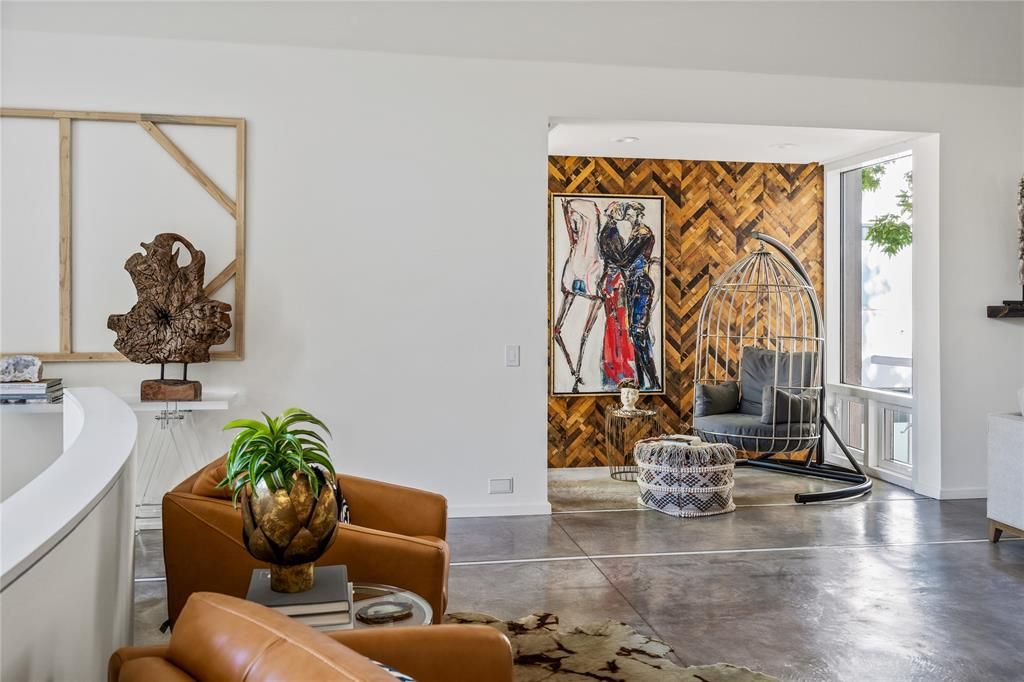 One of several living areas in the Ron Wommack-designed home. (Photo by Briggs Freeman Sotheby's)