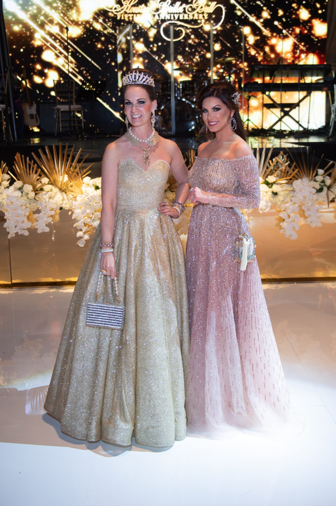 Beth Muecke in a gown from LA design district's Dancing Queen, Nicole Lassiter in a crystal and sequin-embellished tulle gown from Pamella Roland. (Photo by Wilson Parish)
