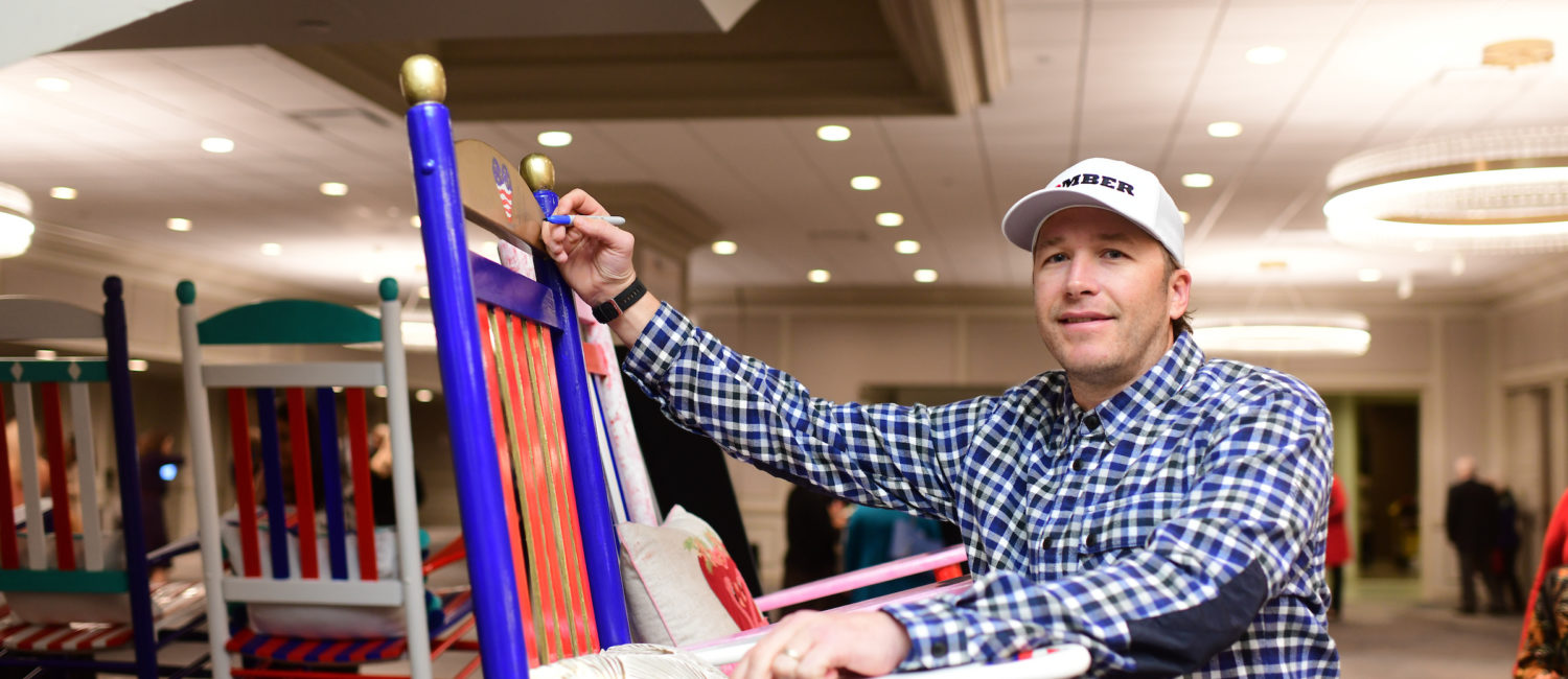 Bode Miller signing rocking chairs photo by Daniel Ortiz