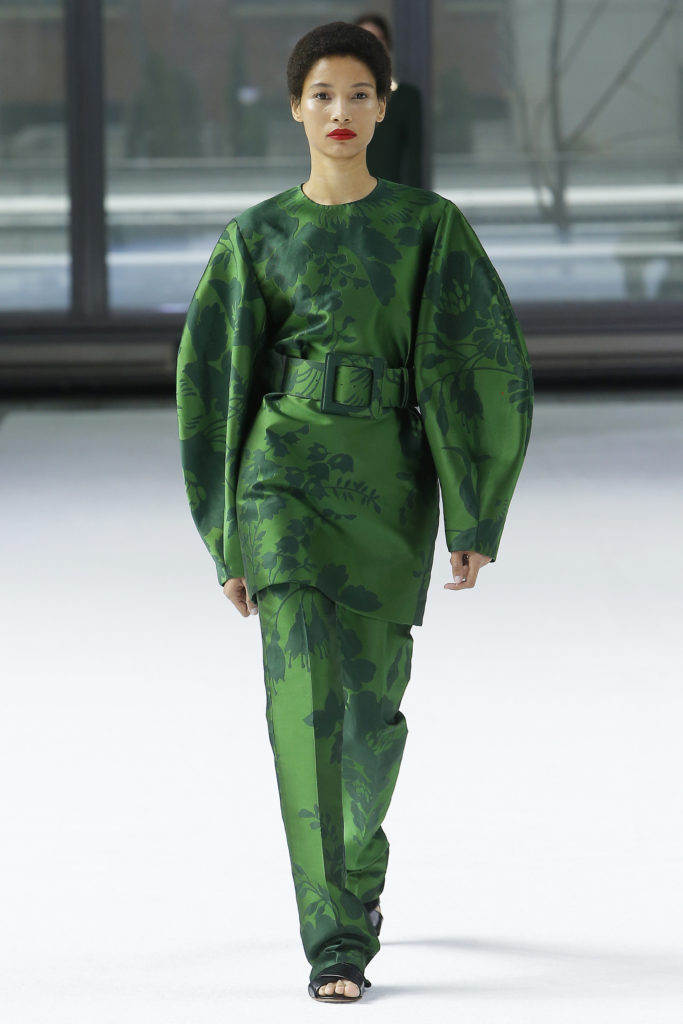 Carolina Herrera garden green floral jacquard long sleeve mini-dress and straight-leg pant, black flat sandal. (Photo courtesy of Carolina Herrera)