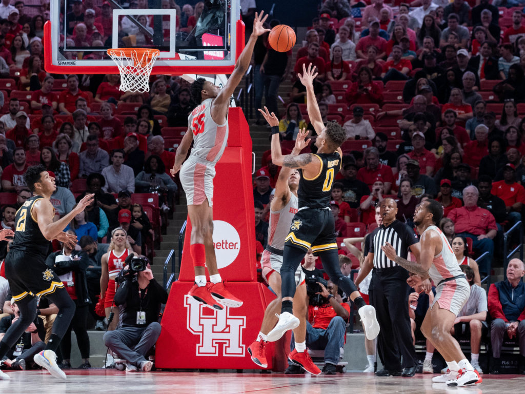 UH basketball's big men know how to throw a block party. Brison Gresham gives the UH student section some love. (Photo by F. Carter Smith)