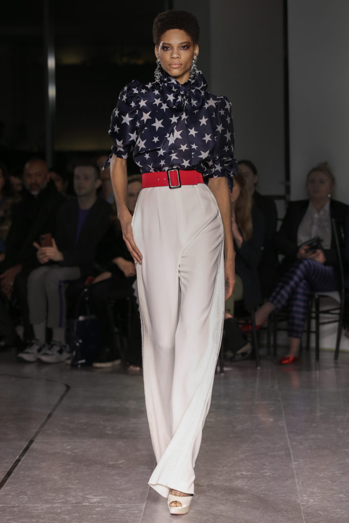 Naeem Khan navy and white star blouse, white trousers, red belt. (Photo by Dan and Corina Lecca)