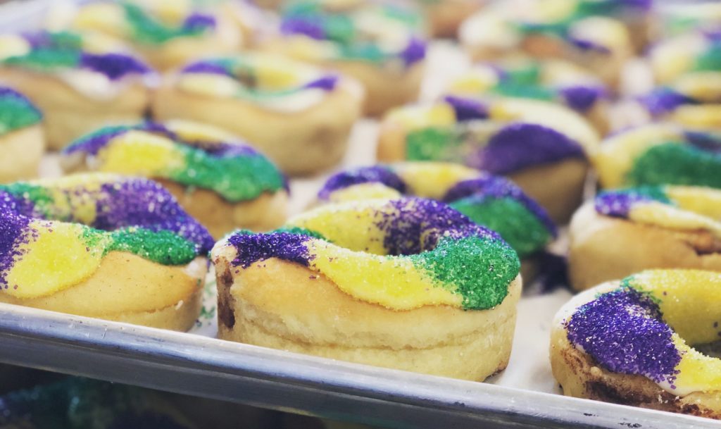 Swing by Haute Sweet for mini King Cakes at Legacy Hall's Mardi Gras celebration.