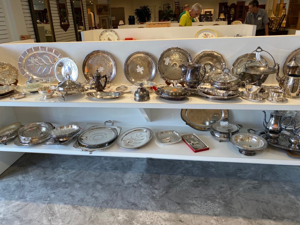 Beaucoup silver plate trays are openly on display while the sterling silver is locked in glass cases. (Photo by Shelby Hodge)