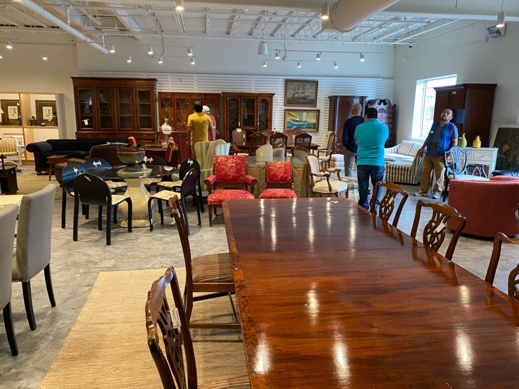 The resale shop has dining tables and chairs galore, beautifully displayed in the new interiors. (Photo by Shelby Hodge)