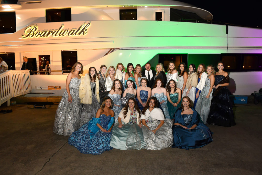 The Knights of Momus duchesses at a pre-San Luis Salute cocktail reception on the dock and on board Tilman Fertitta's yacht, The Boardwalk (Photo by Dave Rossman)