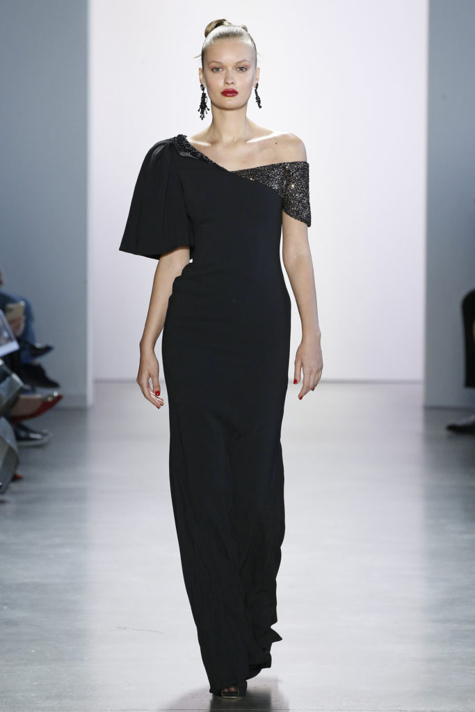 Badgley Mischka black gown with asymmetrical neckline and just a dusting of black sequins at the shoulders affirms the notion that sometimes simplicity is best. (Photo courtesy of Badgley Mischka)