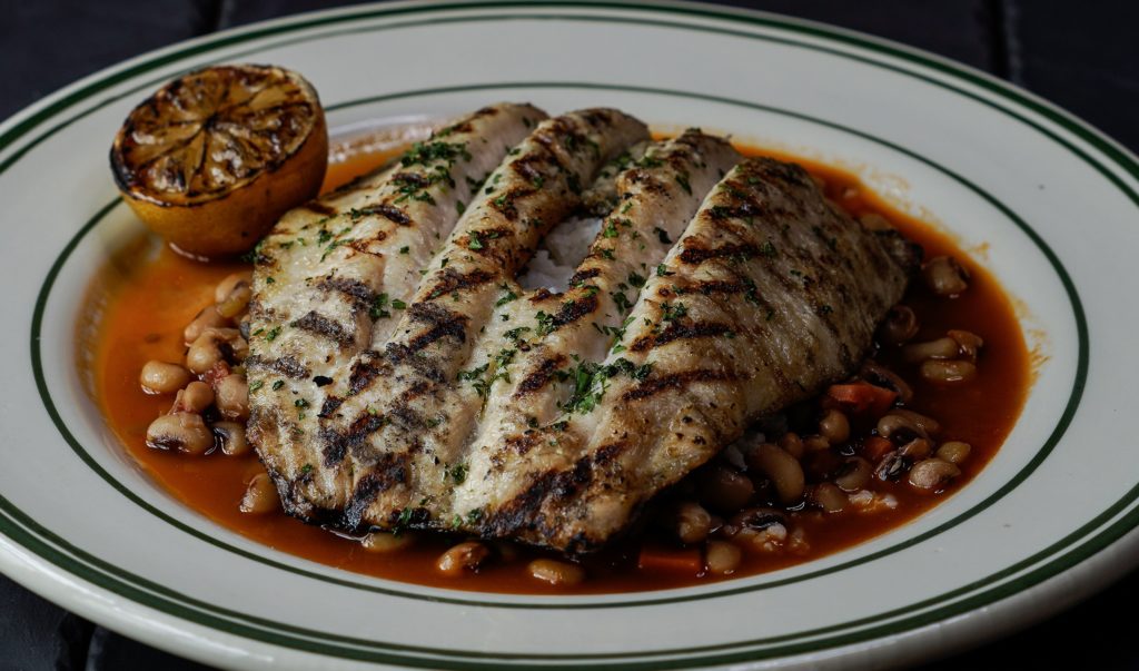 Grilled fish with rice and beans.