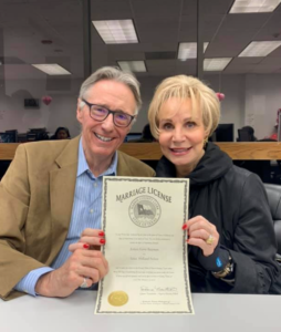 Bob Bowman & Leisa Holland-Nelson pick up the wedding license at City Hall.