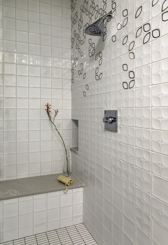 The shower features cleverly designed tiles the resemble colorful raindrops.  (Photo by Kerry Kirk)