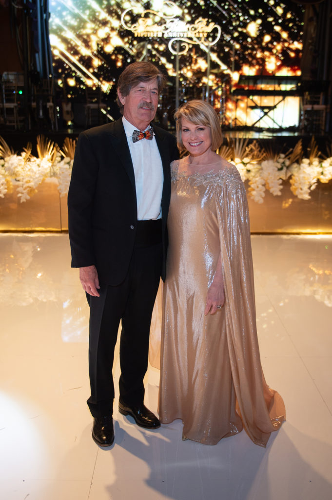 Stephen & Kelley Lubanko in a golden Pamella Roland gown (Photo by Wilson Parish)