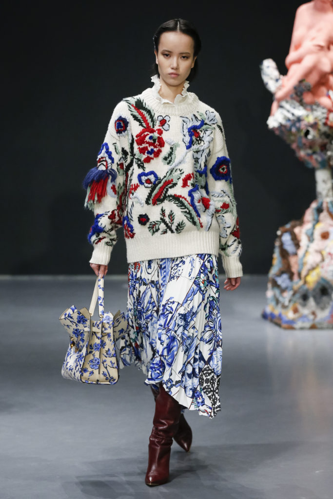 Tory Burch embroidered wool intarsia sweater, plisse georgette top, tile mosaic-print crepe de chine skirt. (Photo courtesy of Tory Burch)