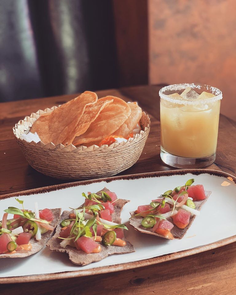 Tuna tostada with avocado, chipotle aioli and cilantro.