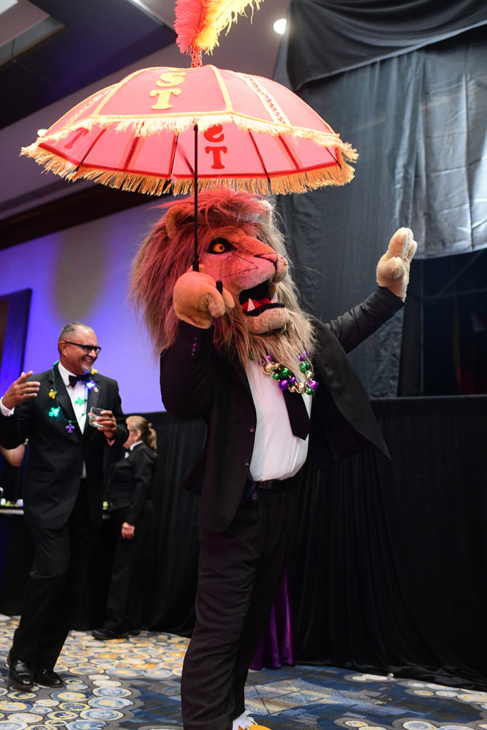 UST mascot Lenny the Lion joins the second line parade that serpentined through the Hilton Americas-Houston ballroom. (Photo by Daniel Ortiz)