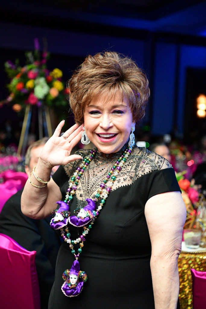 Trini Mendenhall models her earrings by Massimo Palmiero, which she obtained in the live auction. (Photo by Daniel Ortiz)