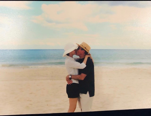 Kelli Cohen and Martin Fein share a beachside kiss on the day of their engagement during a Mediterranean cruise in 1999.
