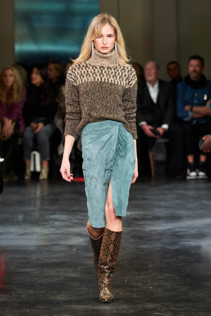 Veronica Beard Bia turtleneck sweater, Sanoe skirt, Freda boots. (Photo by Imaxtree)
