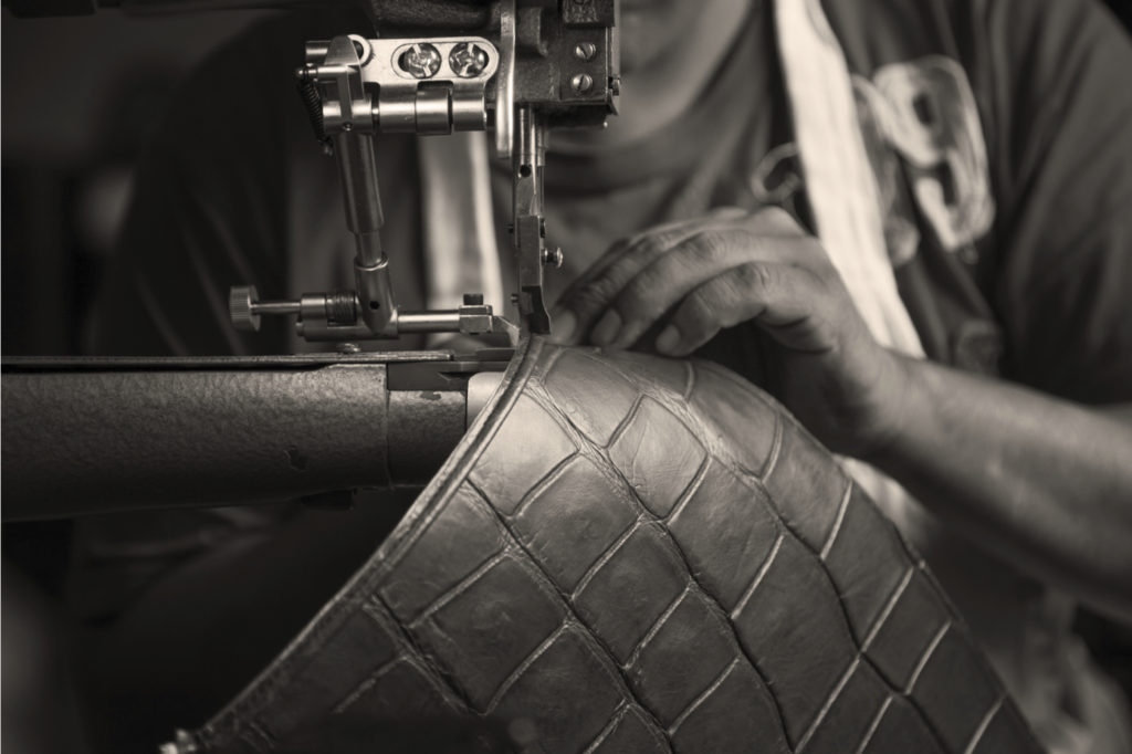 Through large windows, visitors can view the staff of 25 artisans handcraft each bag from a variety of fabrications. (Photo courtesy of Hayward)