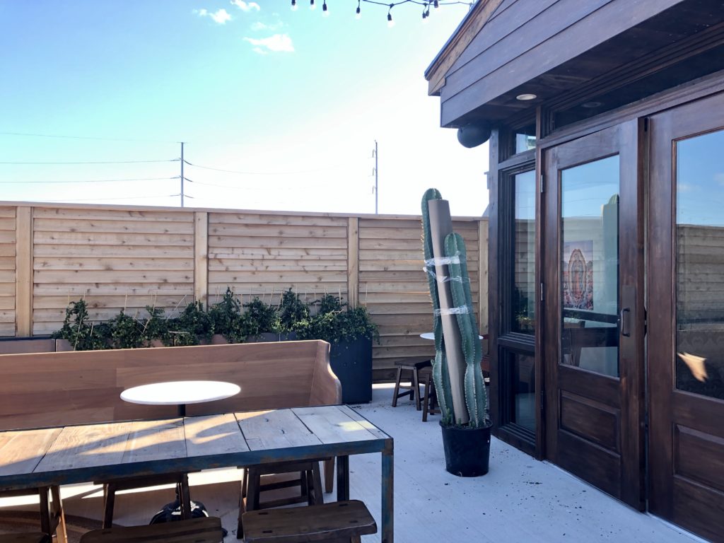 Greenery, twinkle lights and lounge seating await. Photo by Courtney Dabney.