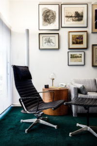 In the den, velvet green carpet by Walsh. Eames Aluminum Group Lounge chair and ottoman. The room is home to the couple’s collection of prints, including works by Thomas Hart Benton, Ben Shahn, Carol Summers, Leonard Baskin, and Agam – arranged by Walsh. (Photo by Pär Bengtsson)
