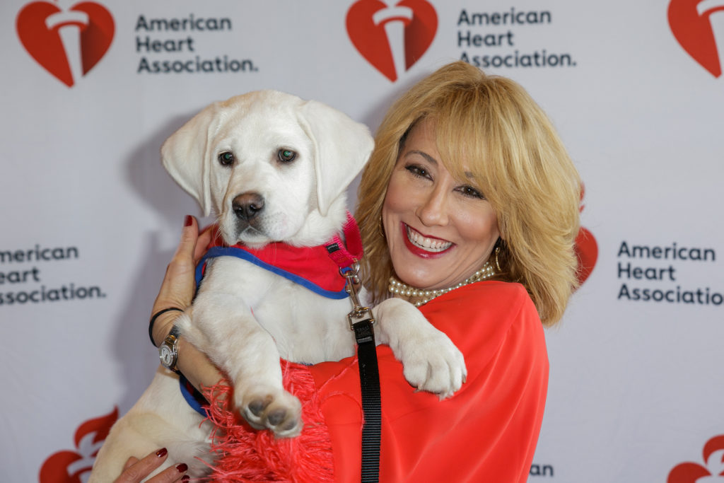 Keynote speaker Dr. Suzanne Steinbaum cuddles a furry, hypertension-reducing friend.  (Photo by WJNPhoto)