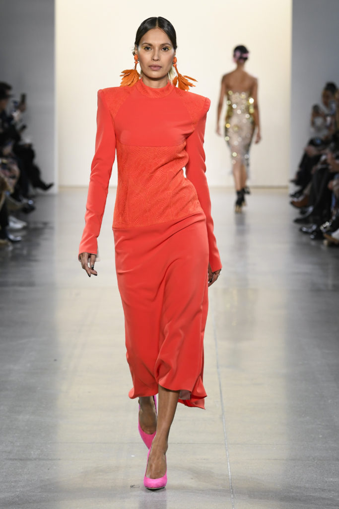 Bibhu Mohapatra sindoor red crepe and lace dress with sculpted shoulders. (Photo by Yannis Vlamos/Indigital.tv)