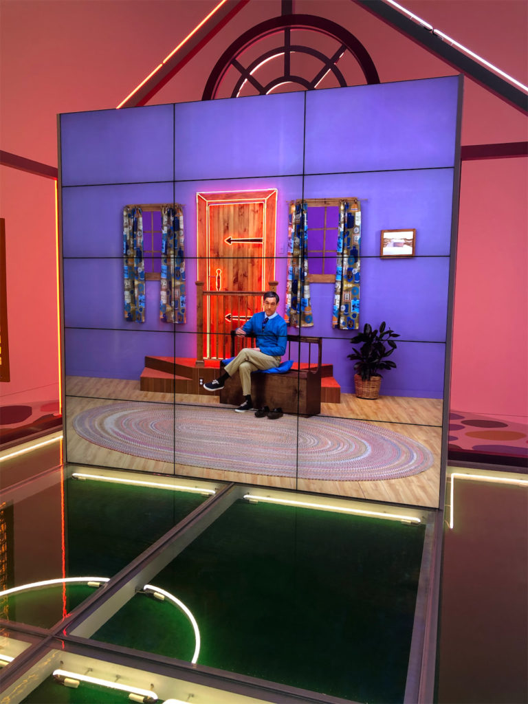 57 clips, such as De Corte dressed up as Mr. Rogers, play over three hours in the house. (Photo by Megan Ziots)