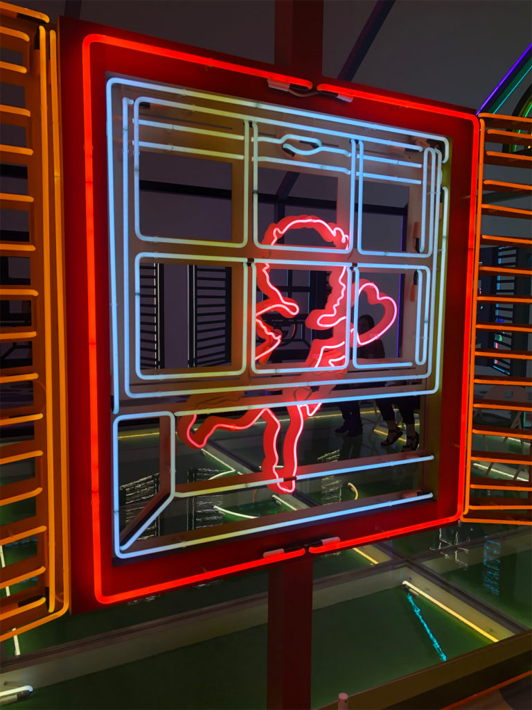 Made out of glass, aluminum, and neon,  the Neon House stands out with details. (Photo by Megan Ziots)