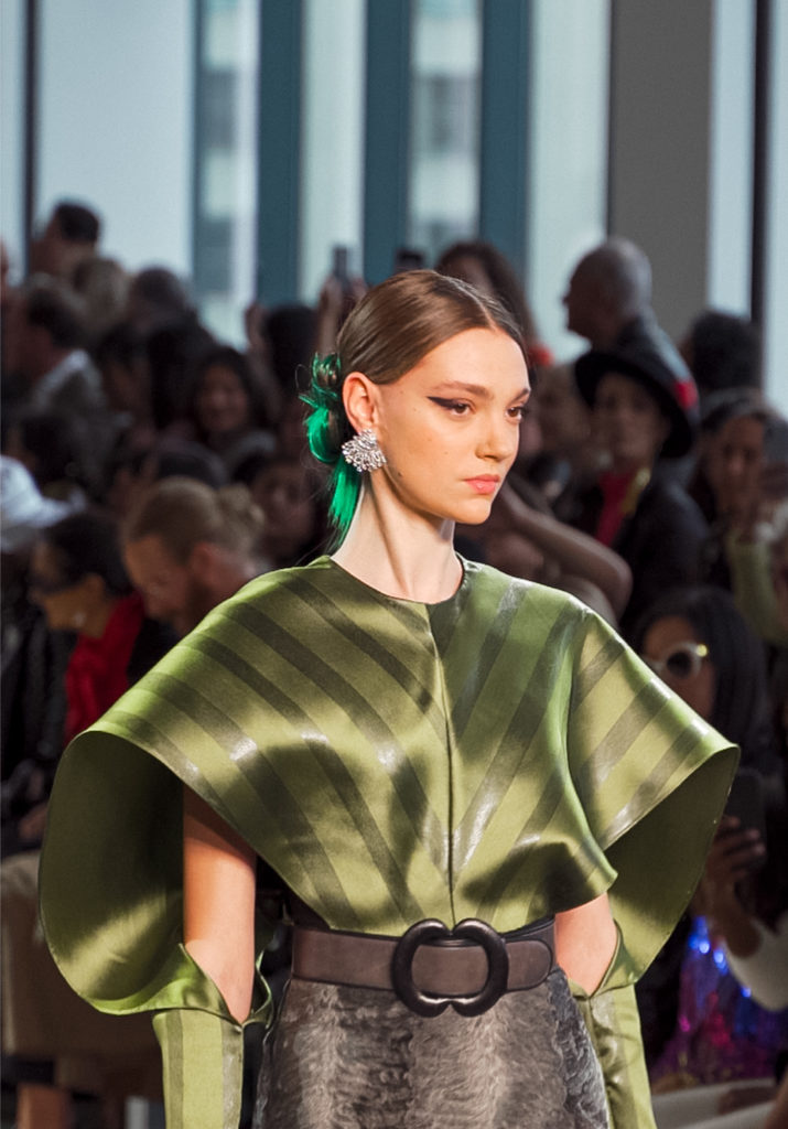 Bibhu Mohapatra henna striped silk winged top with smoke broadtail embroidered skirt. (Photo by Anna Vivare)