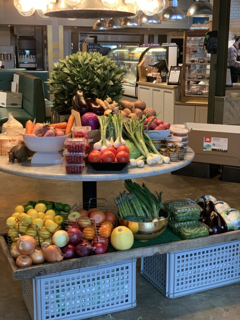 Fresh fruits and vegetables are among the essentials on the shelves at Local Foods Rice Village pop up market. (Photo by Local Foods)