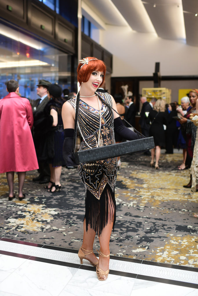 The Roaring Twenties theme was captured in a flapper offering 'cigarettes.' (Photo by Daniel Ortiz)