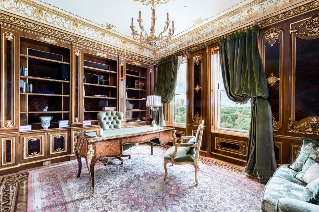 The handsome wood-paneled study and personal library  (Photo courtesy Douglas Elliman )